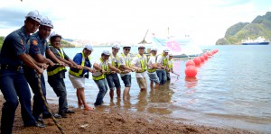 Globe and Huawei executives, along with community stakeholders, lead the cable landing activity in Coron, Palawan.