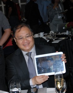 SMART Communications and PLDT Chairman and Cignal founder Manny V. Pangilinan  shows off the latest innovation in television viewing, Cignal TV-to-Go, which allows Cignal subscribers to watch their favorite TV shows continuously even on their mobile devices. 